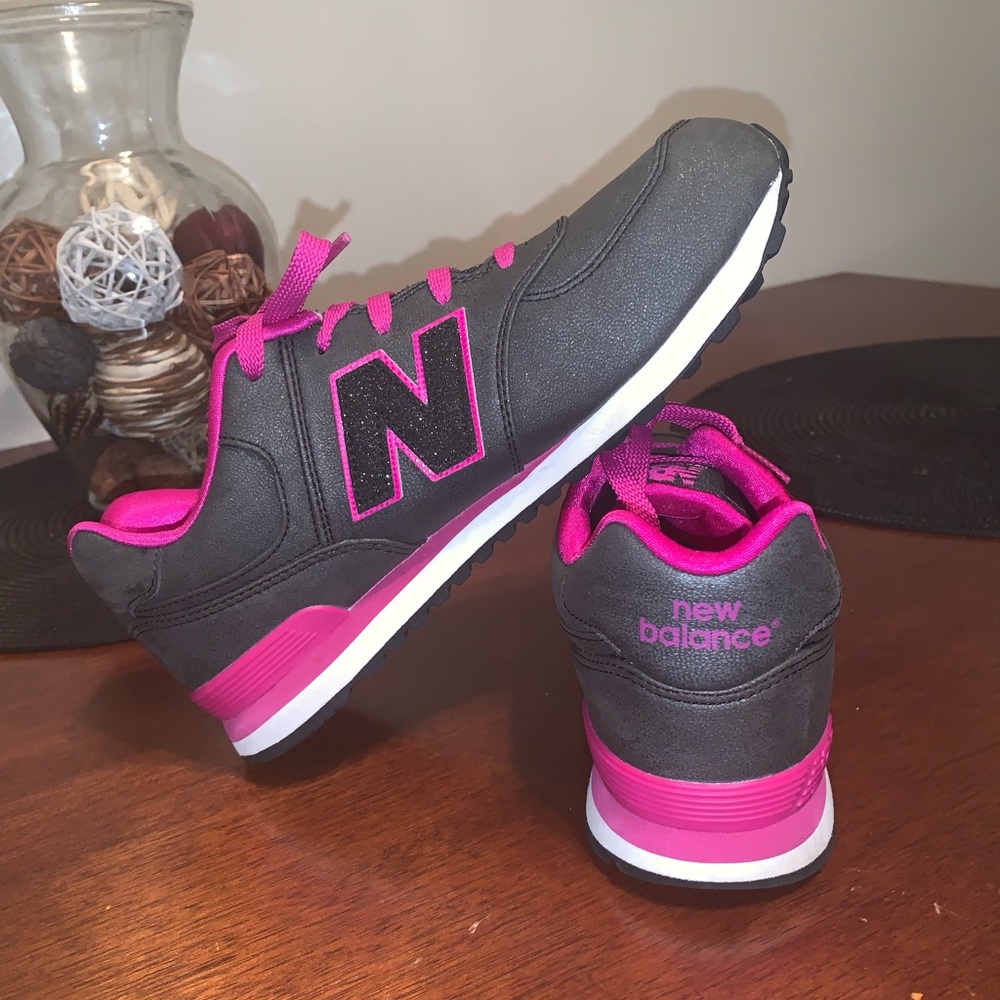 Dark gray, fuchsia, and white New Balances